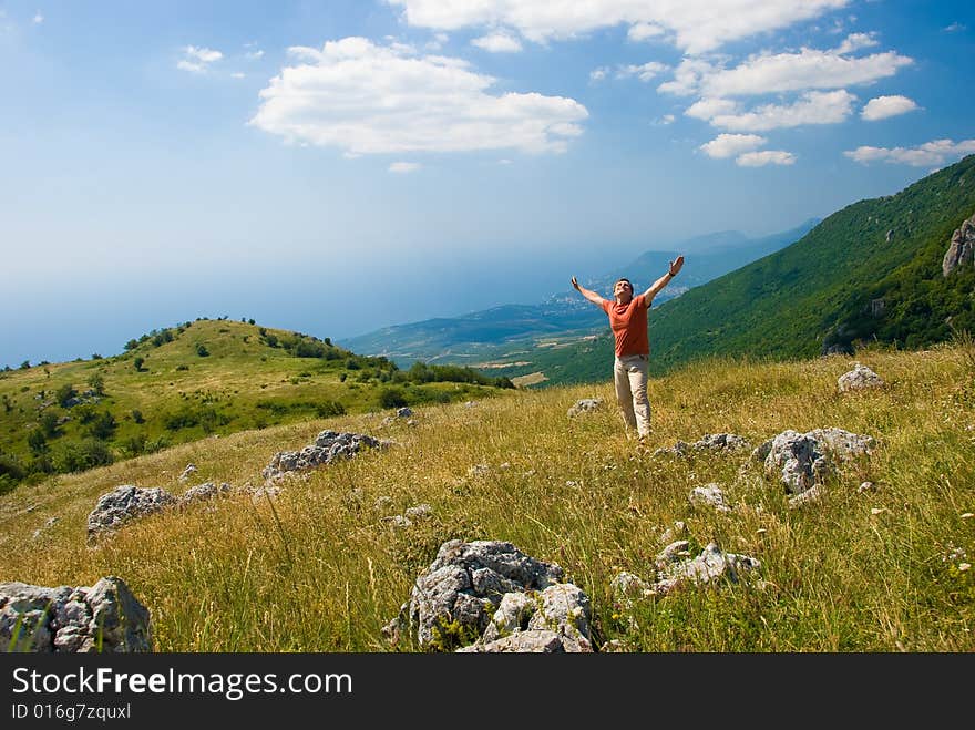 Happy man on a beautiful mountain nature in Crimea, Ukraine. Happy man on a beautiful mountain nature in Crimea, Ukraine