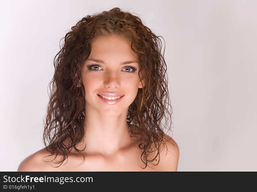 Smiling young girl isolated in studio