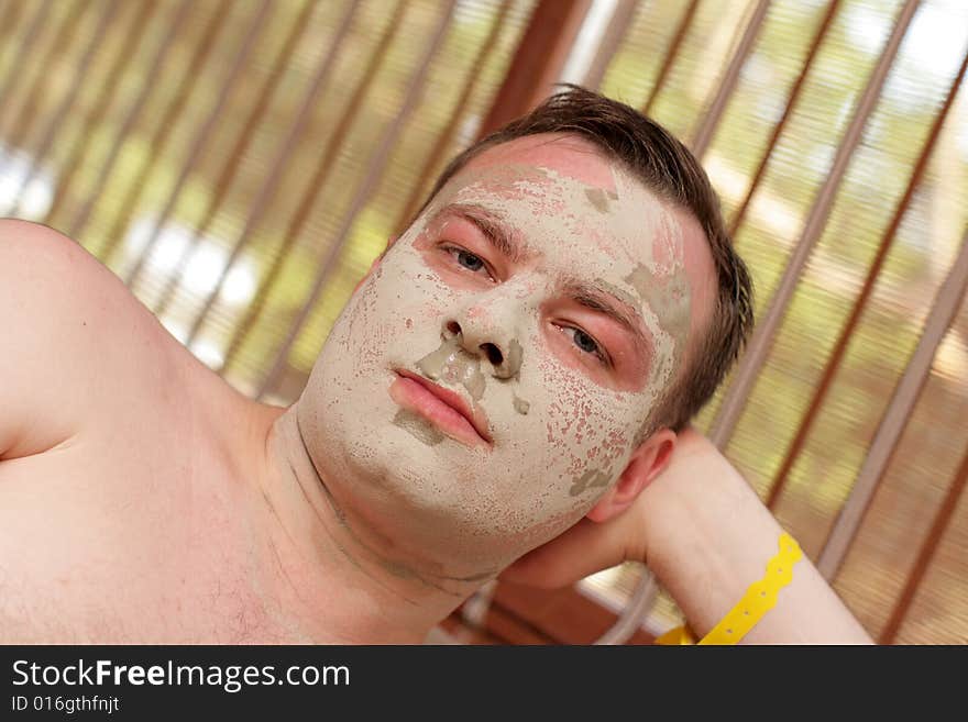 Man in cosmetic mask