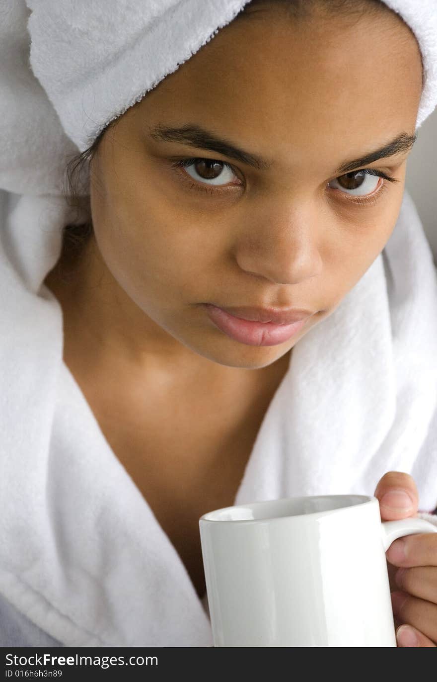 Photo of a young pretty girl with a mug. Photo of a young pretty girl with a mug