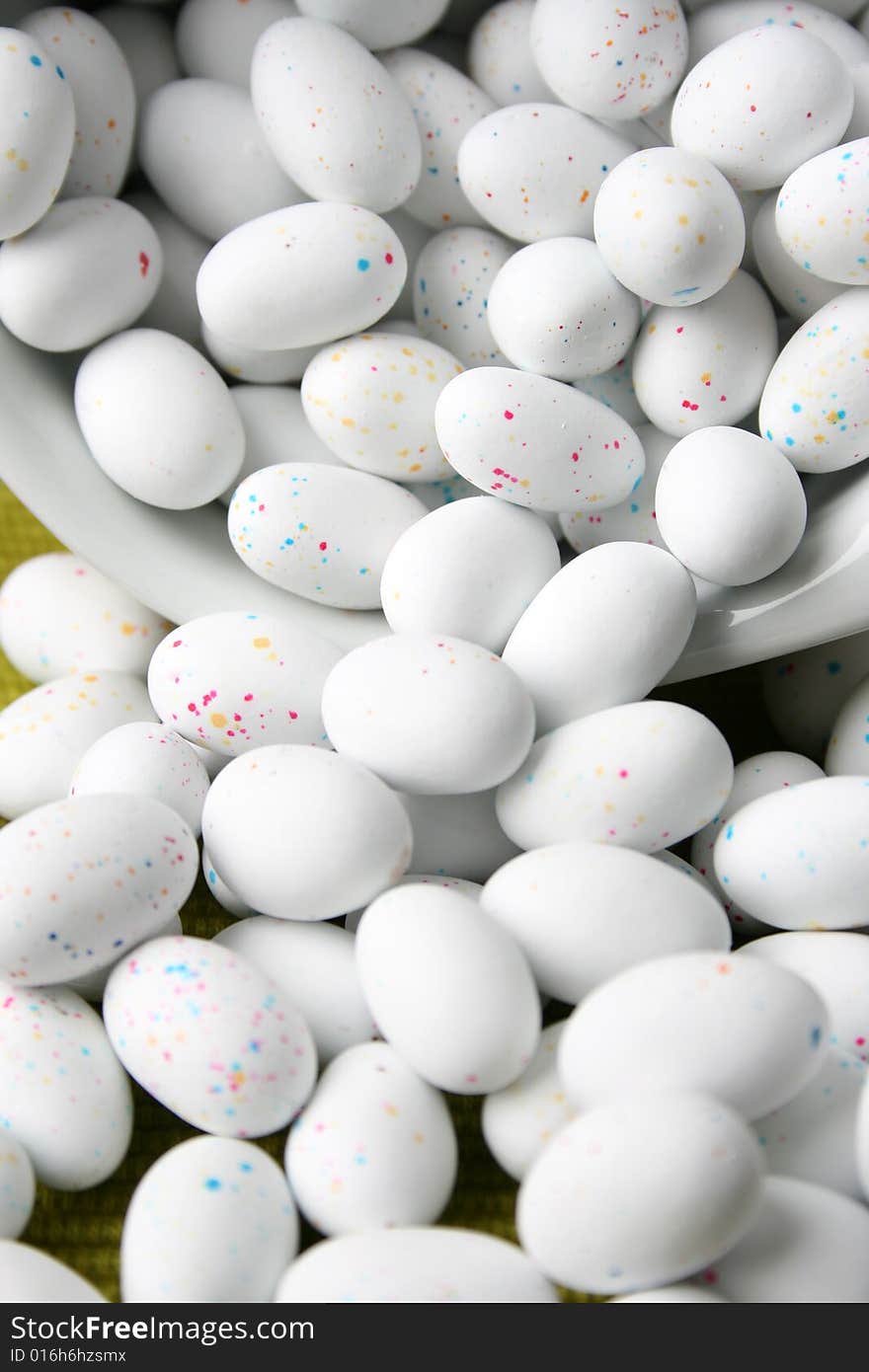 Miniature speckled easter eggs in a green bowl. Miniature speckled easter eggs in a green bowl