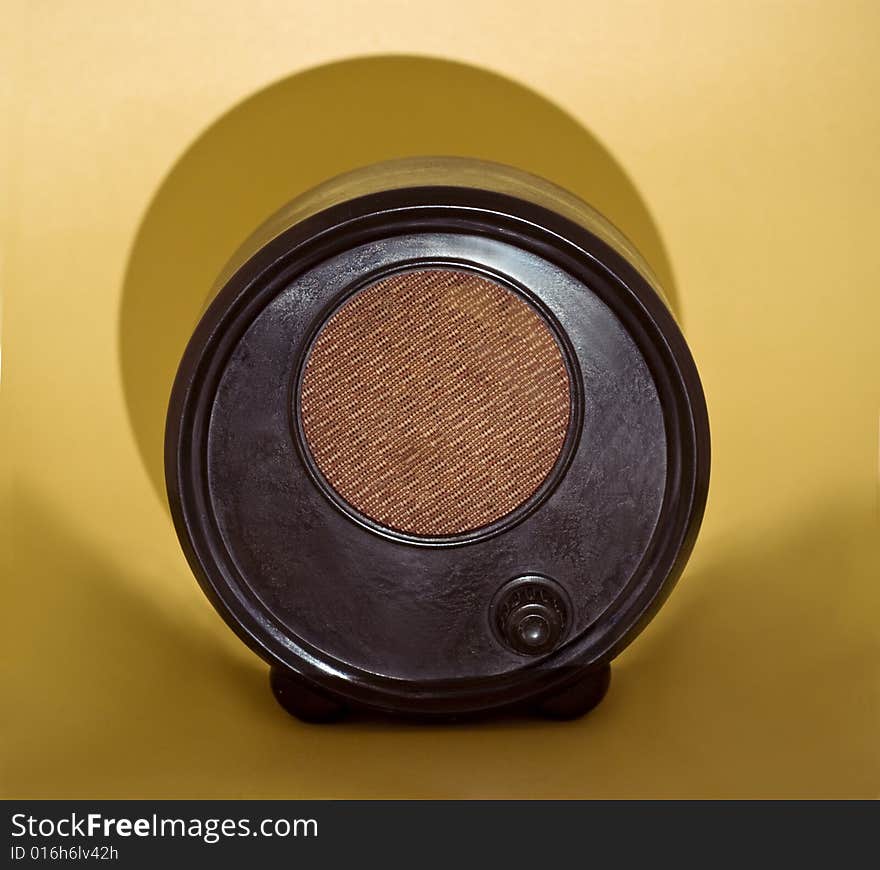 Vintage radio close-up isolated on brown background