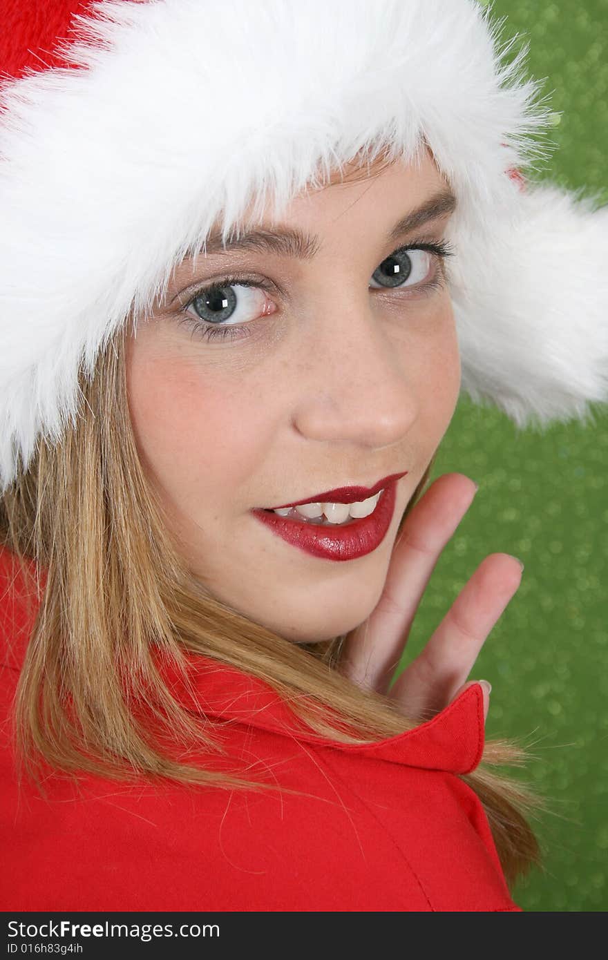 Teenager with red lips wearing a christmas hat. Teenager with red lips wearing a christmas hat