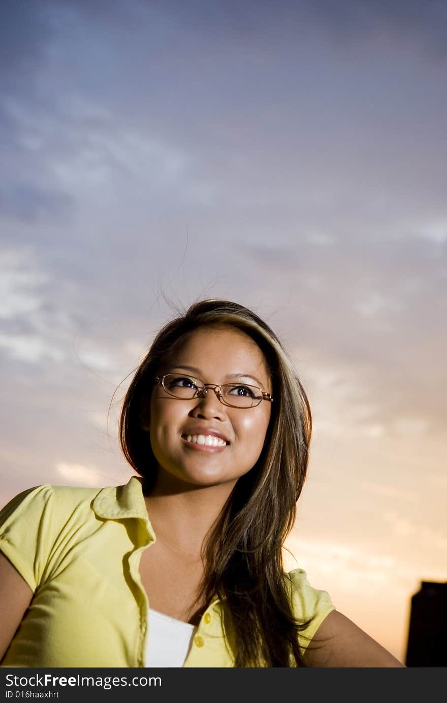 Female outside enjoying sunset with feeling of joy. Female outside enjoying sunset with feeling of joy