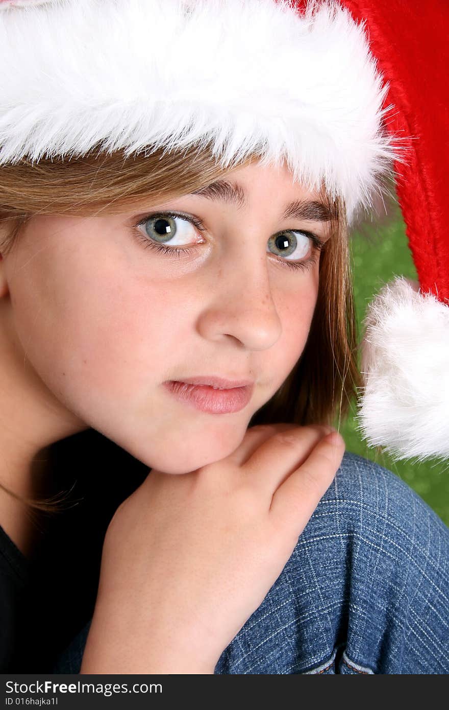 Beautiful teenager girl wearing a christmas hat. Beautiful teenager girl wearing a christmas hat