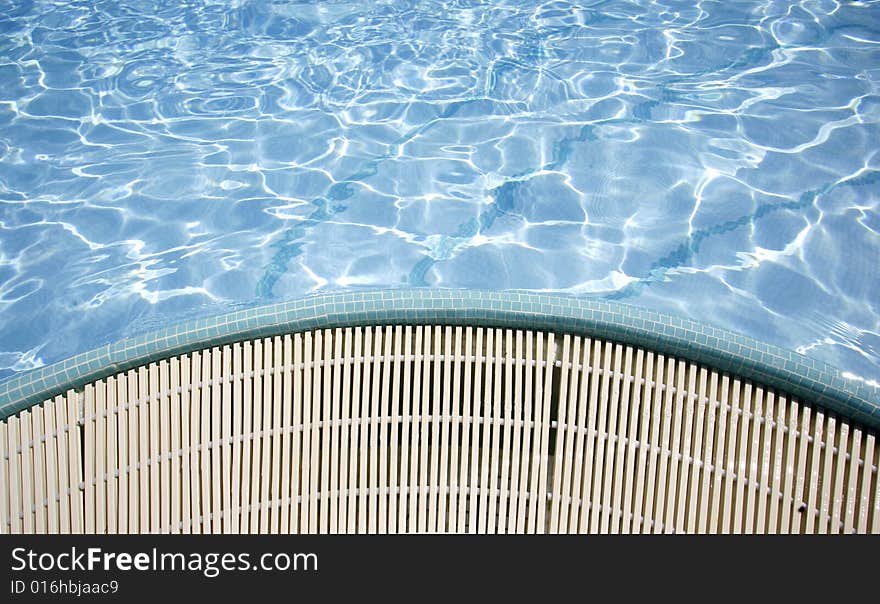 Swimming pool sun reflections and water overflow. Swimming pool sun reflections and water overflow