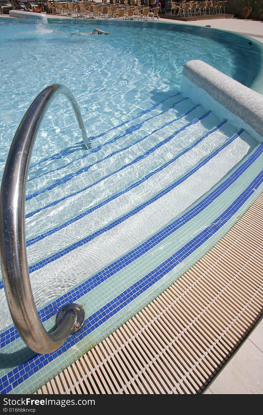 Swimming pool steps leading into water