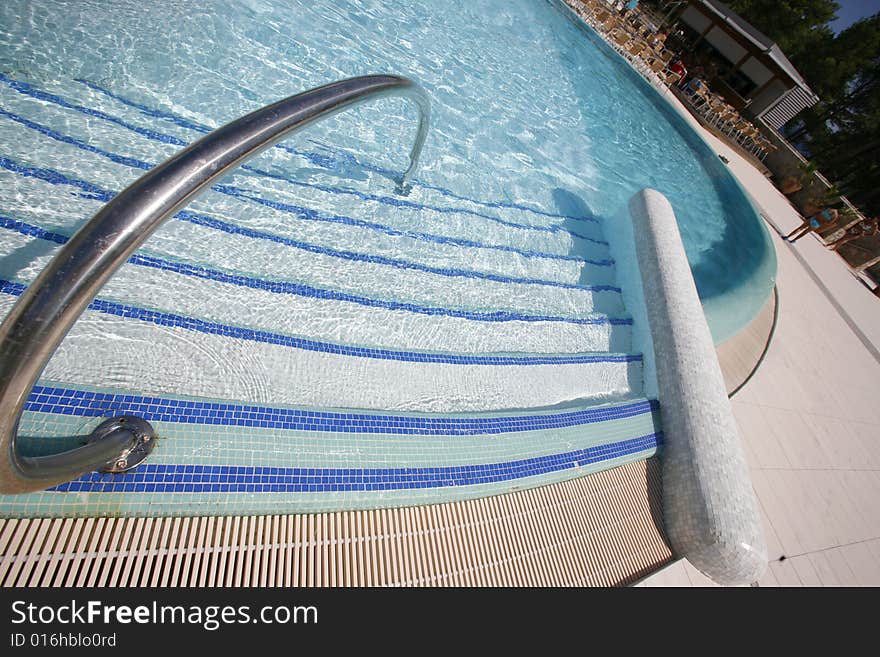 Swimming pool steps leading into water