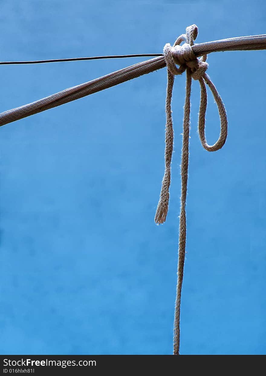 A knot made of nylon against blue background