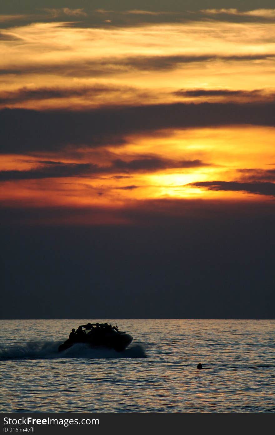 A speed boat cruising into the sunset at Rovinj Croatia. A speed boat cruising into the sunset at Rovinj Croatia