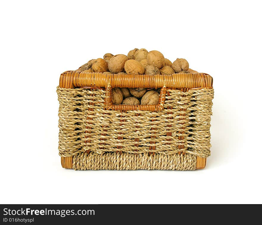 Bakest of nuts isolated on white background