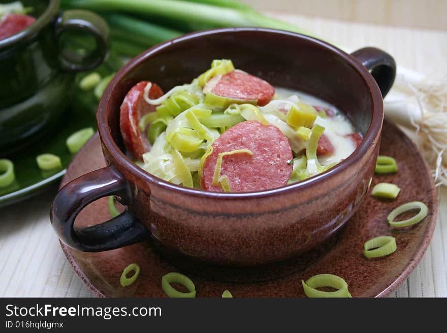 A fresh soup of green leak with sausages