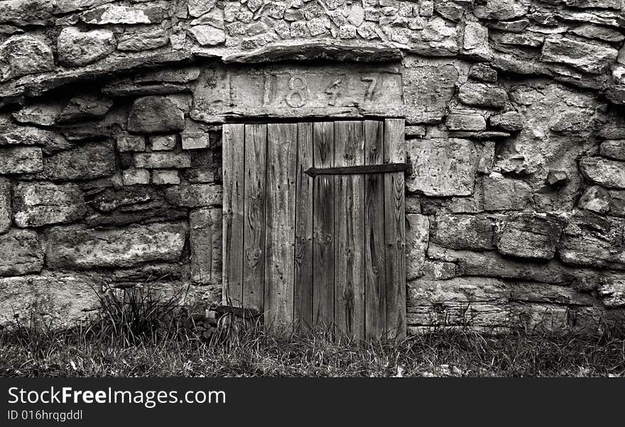 Old door in an old wall - year 1847