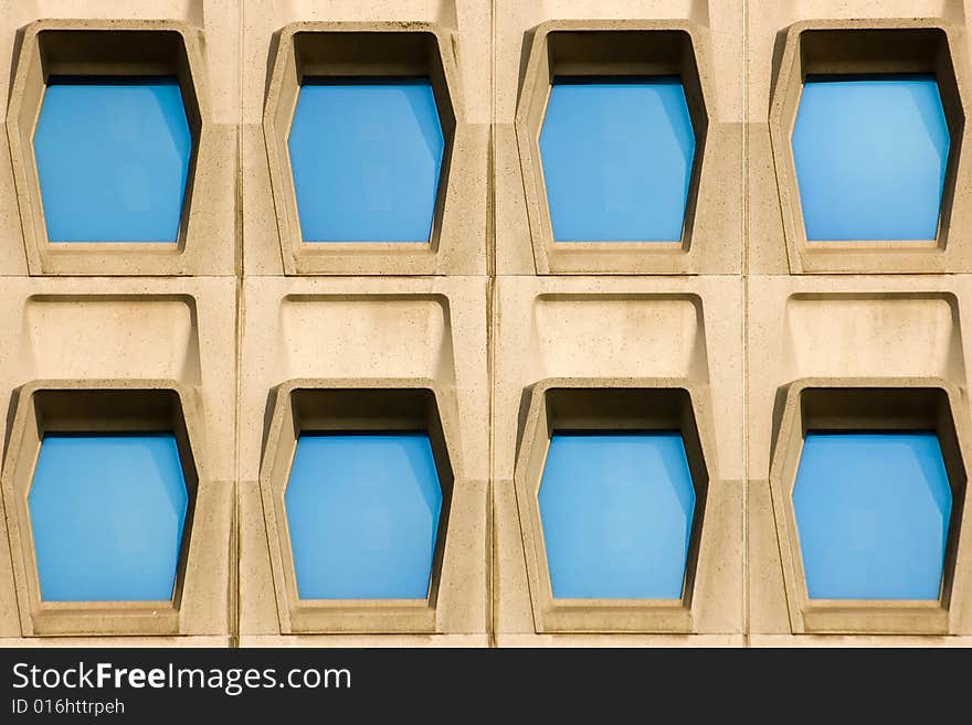 Facade of a modern office building with blue windows. Facade of a modern office building with blue windows