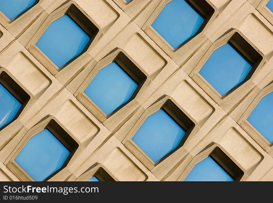 Facade of a modern office building with blue windows. Facade of a modern office building with blue windows