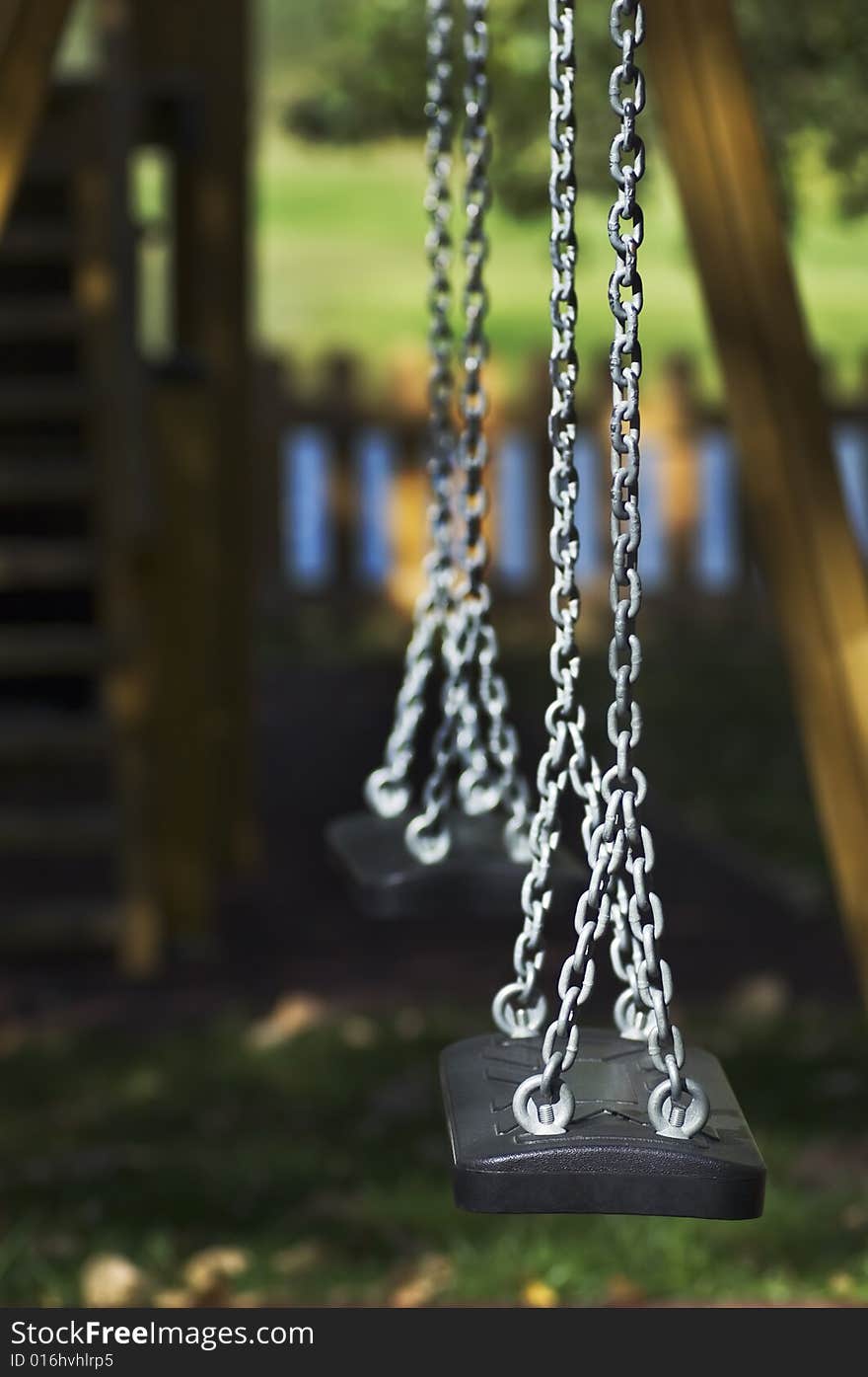 Still swing detail in a playground