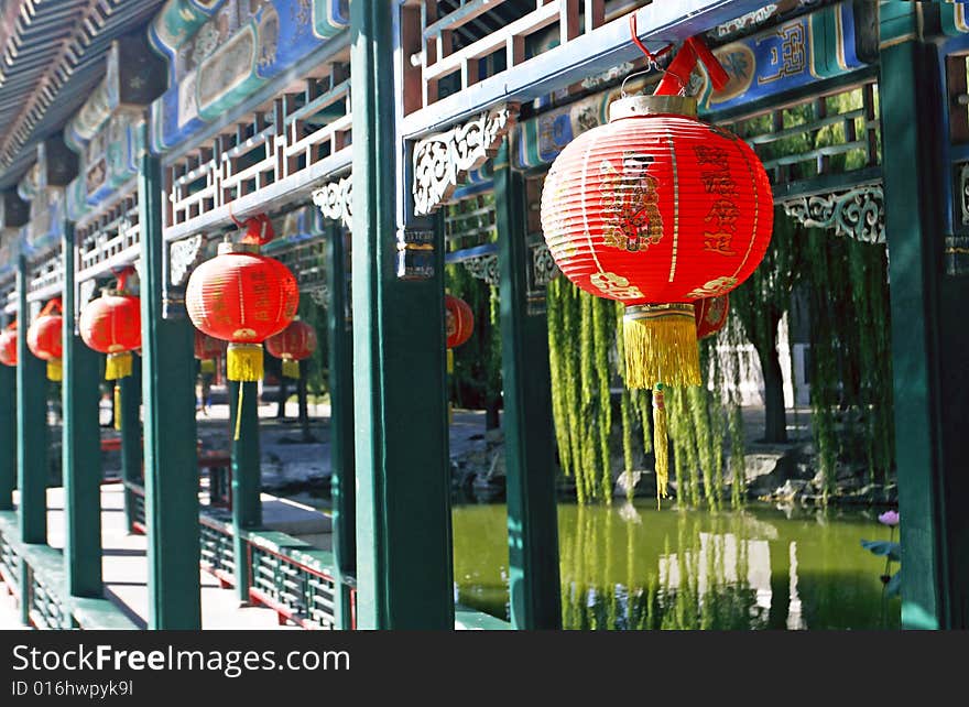 Red lantern on the ancient garden long corridor of China.

Chinese on the lantern is that a good luck is lucky.