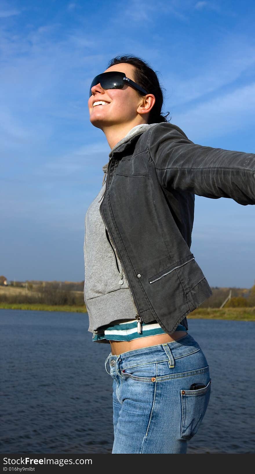 Attractive happy girl with open hands