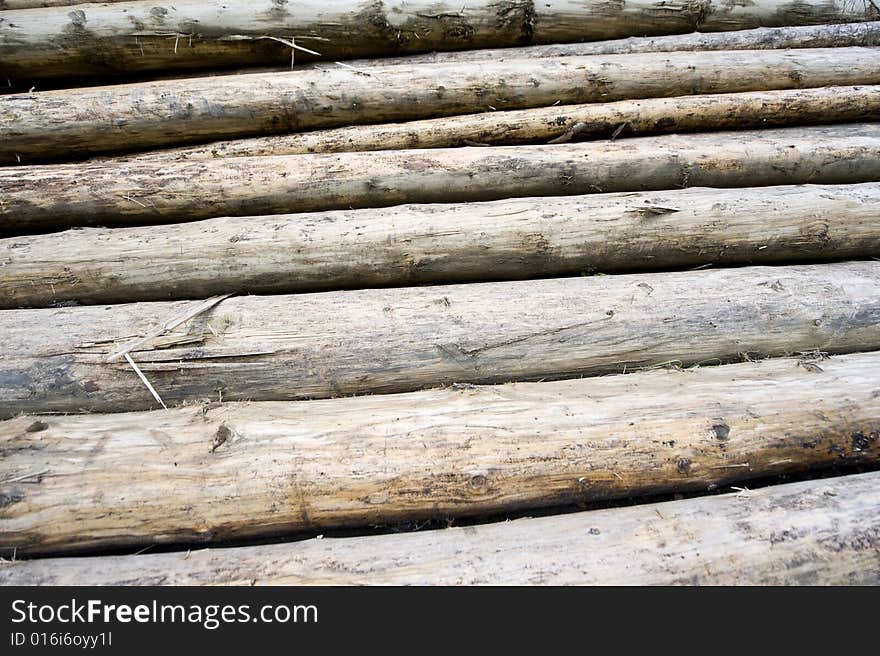 Background made of many long woodpiles in stack. Background made of many long woodpiles in stack