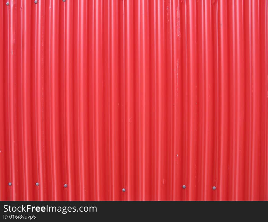 A red metal wall background