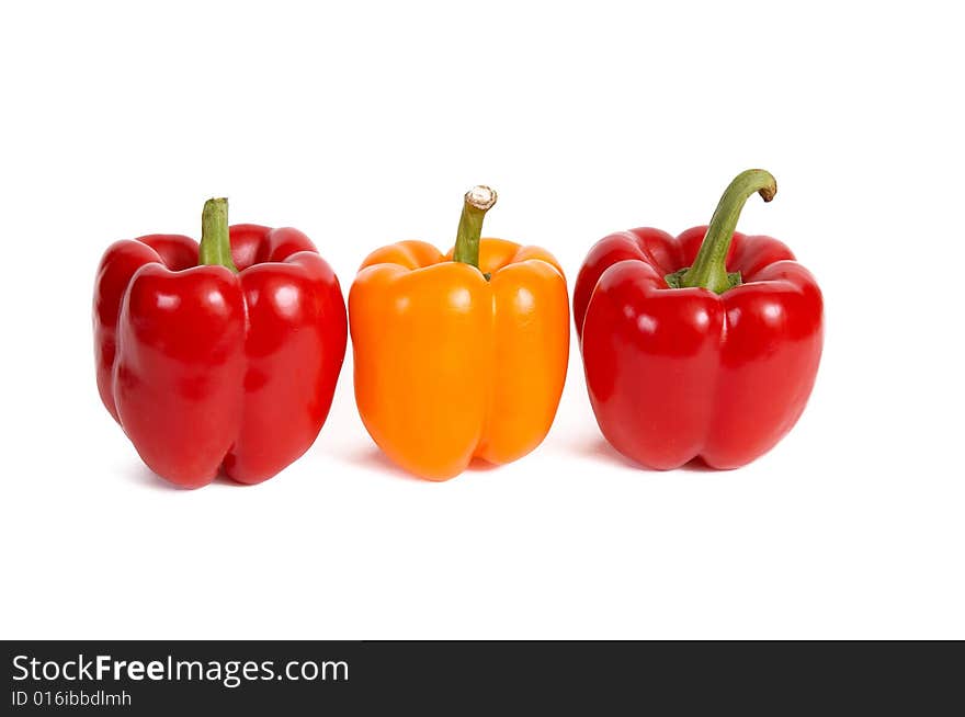 Three red peppers isolated on a white background. Three red peppers isolated on a white background.