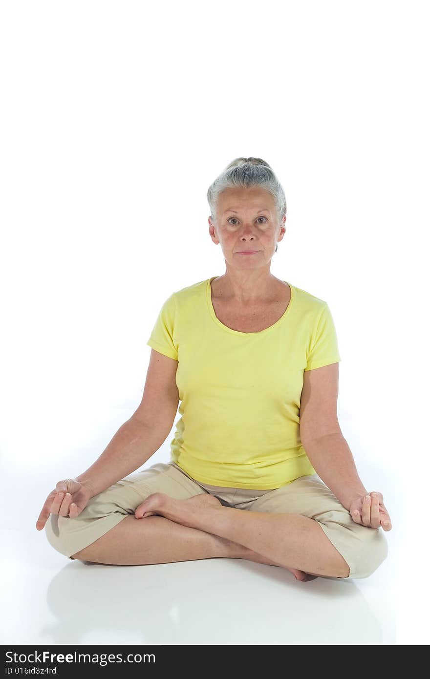 Senior woman in yoga pose on white background. Senior woman in yoga pose on white background