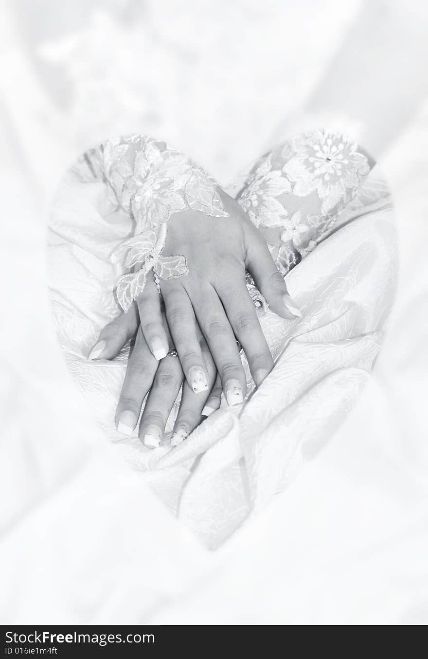 Hands of the young bride