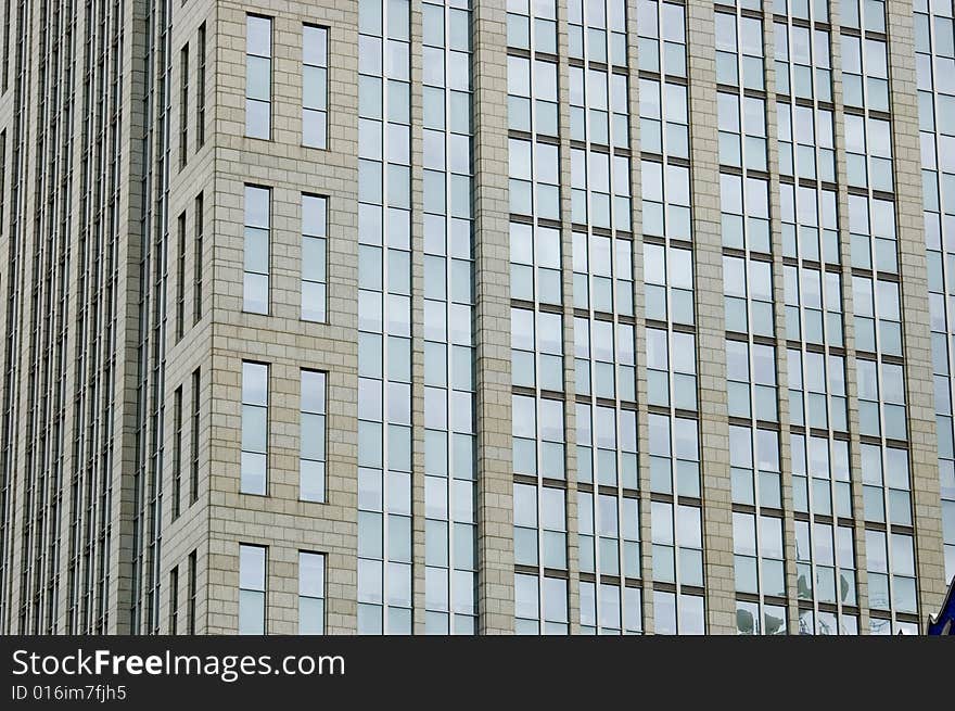 China, Shanghai. City center with modern skyscrapers, office buildings. Closeup photo showing windows, panels, walls, roofs. China, Shanghai. City center with modern skyscrapers, office buildings. Closeup photo showing windows, panels, walls, roofs.