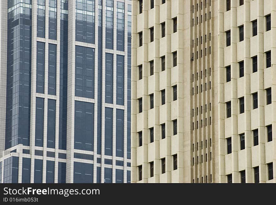 China, Shanghai. City center with modern skyscrapers, office buildings. Closeup photo showing windows, panels, walls, roofs. China, Shanghai. City center with modern skyscrapers, office buildings. Closeup photo showing windows, panels, walls, roofs.