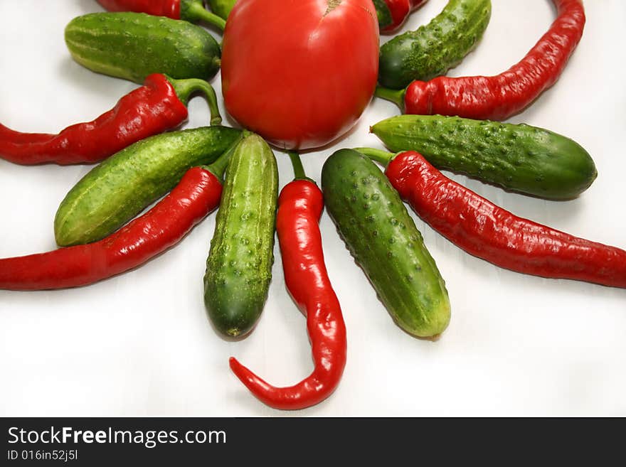 Chilies, Tomato and Cucumbers arranged in a star. Chilies, Tomato and Cucumbers arranged in a star