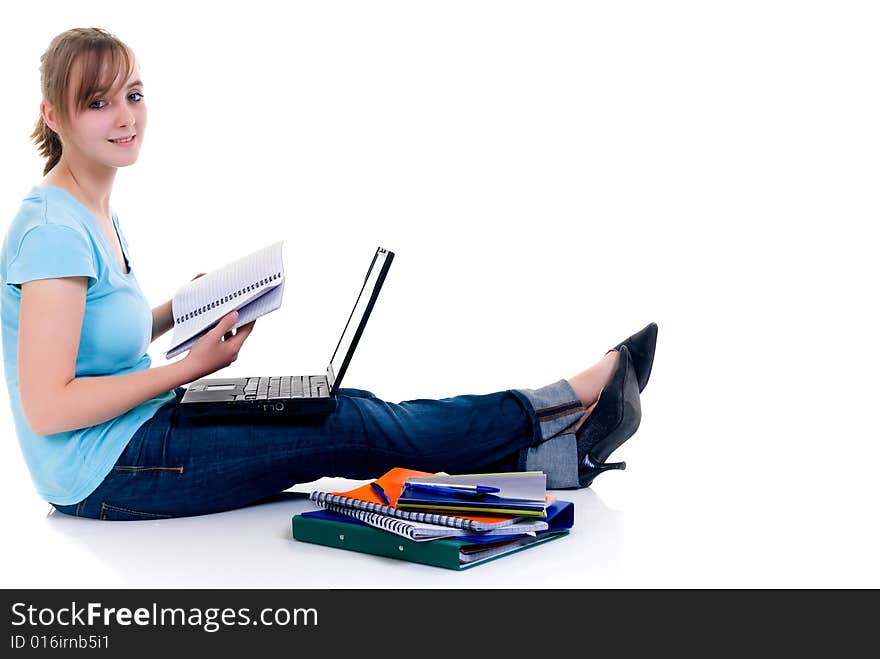 Teenager schoolgirl with laptop on white background