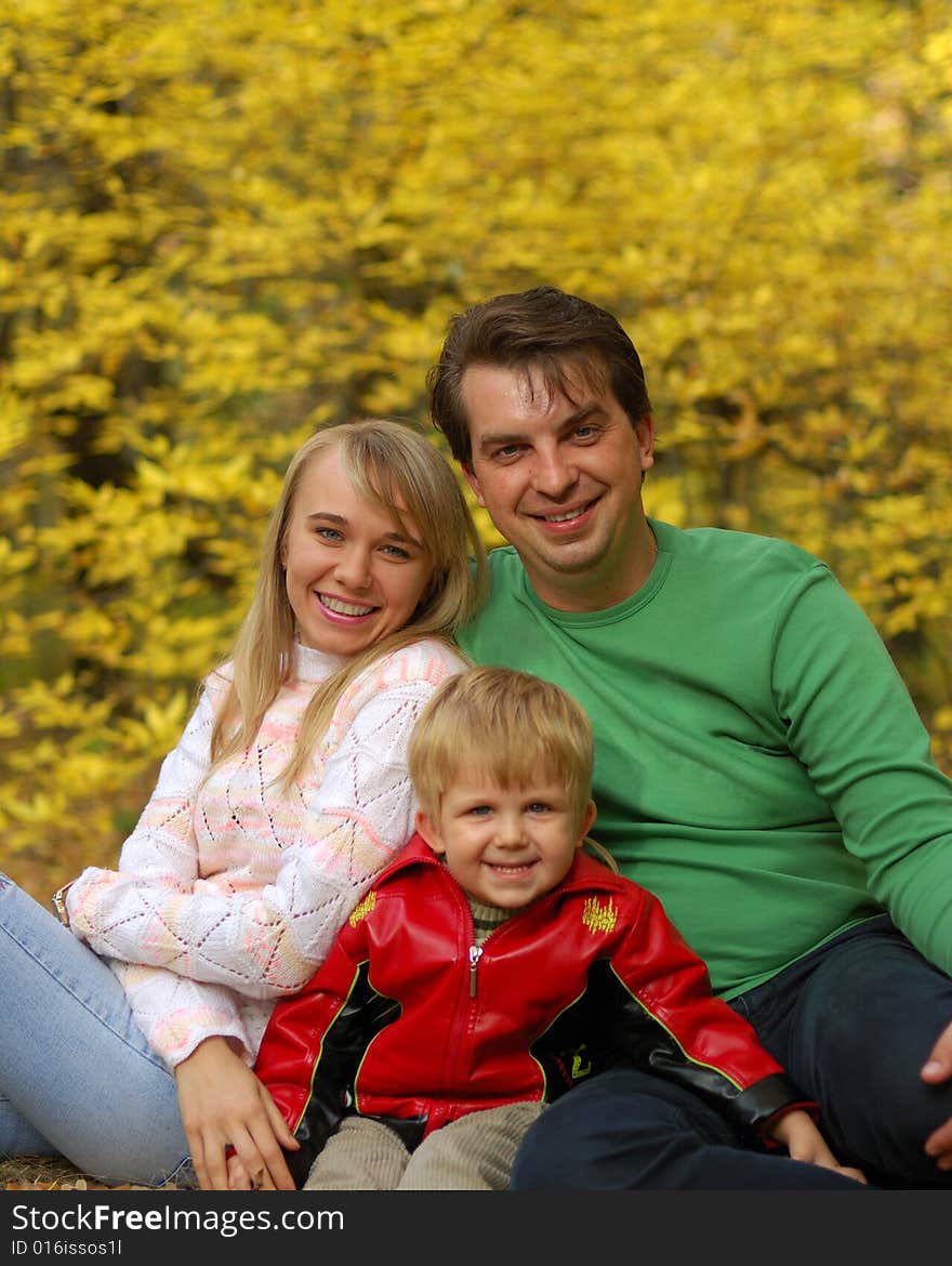 Family in autumn forest