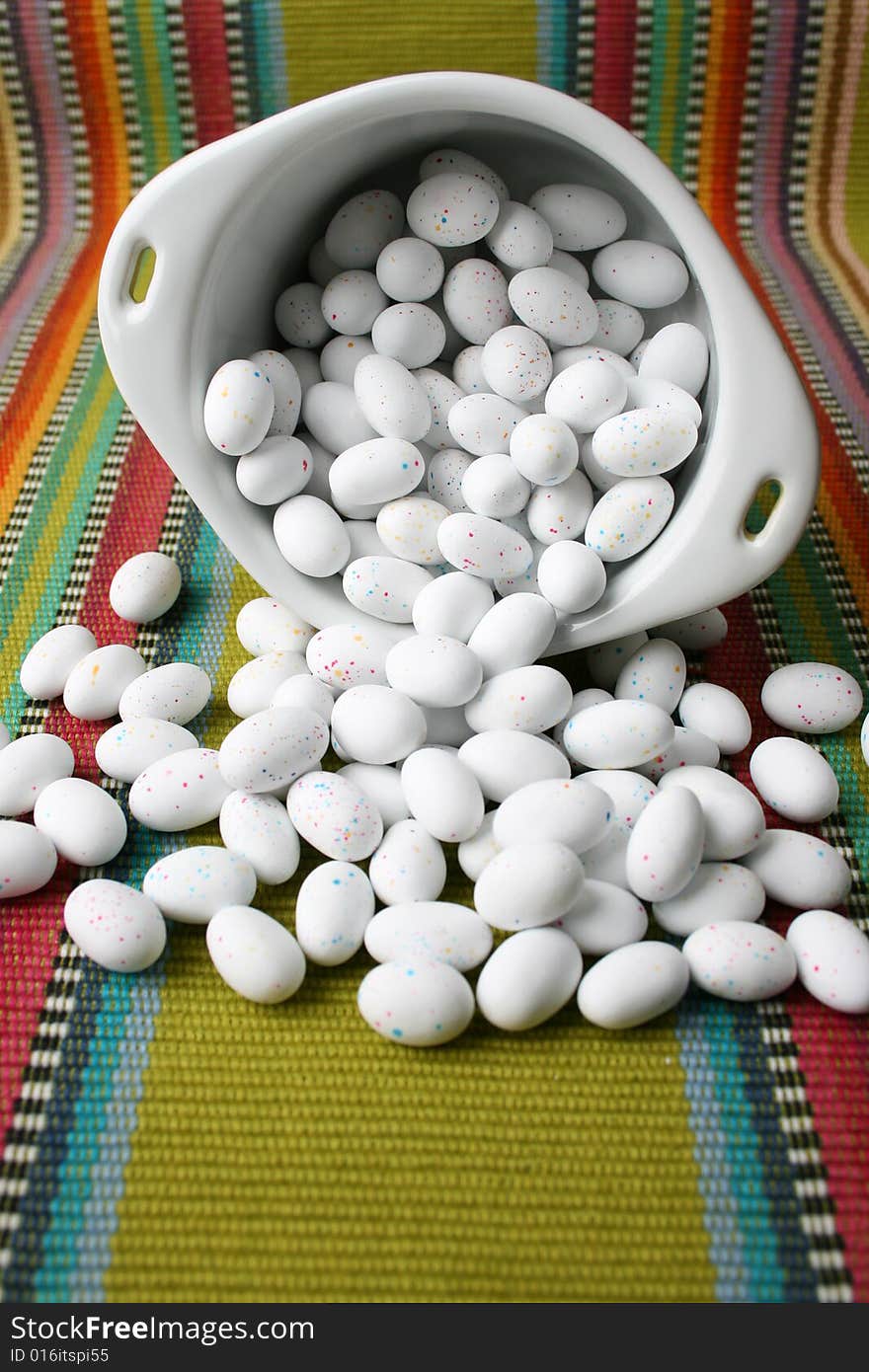 Miniature speckled easter eggs in a green bowl. Miniature speckled easter eggs in a green bowl