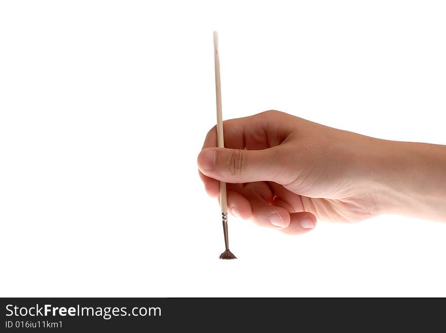 Brush in hand on a white background