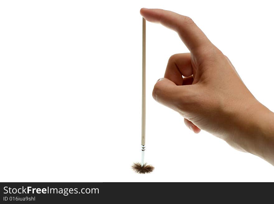 Brush in hand on a white background