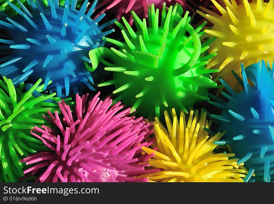 Background of colorful soft spiny rubber fish toys. Background of colorful soft spiny rubber fish toys