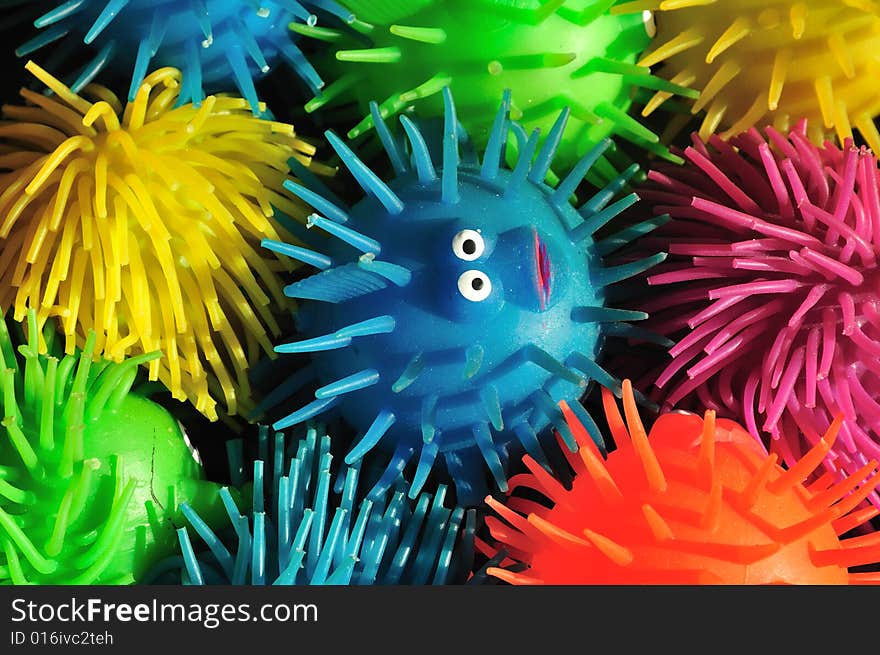 One wide-eyed squishy puffer fish lost in a sea of color. One wide-eyed squishy puffer fish lost in a sea of color