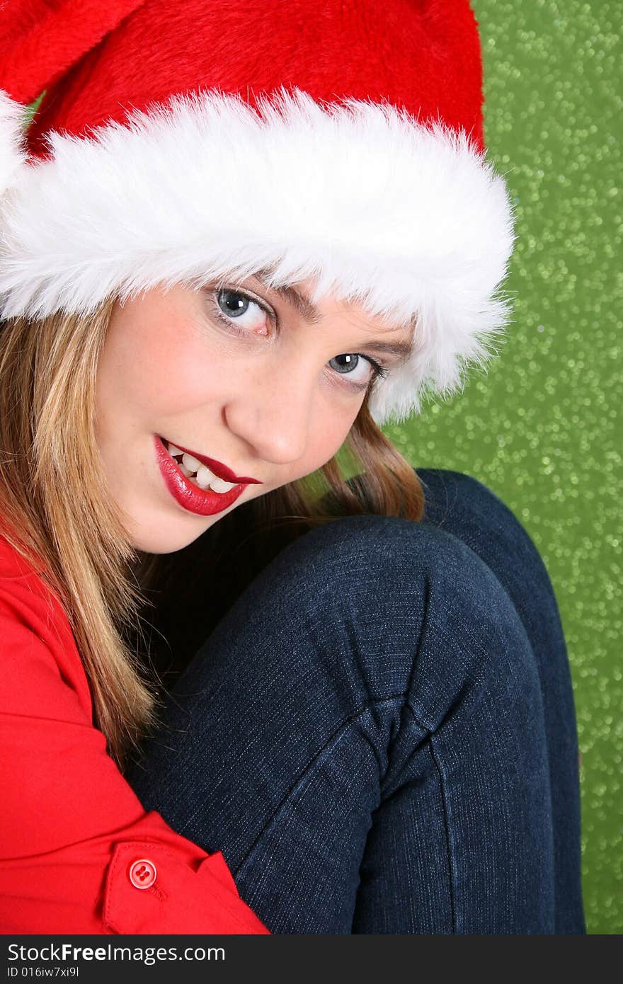 Teenager with red lips wearing a christmas hat. Teenager with red lips wearing a christmas hat