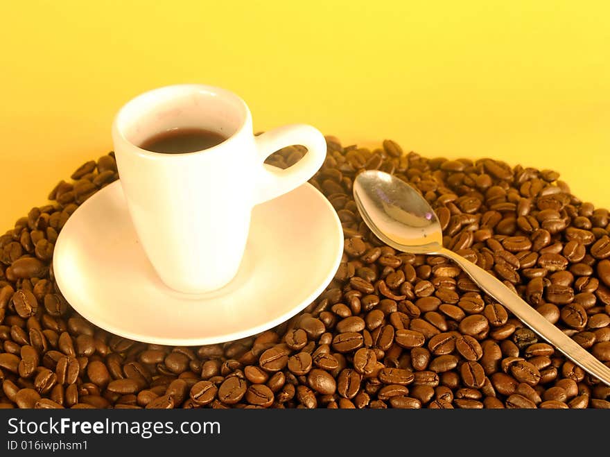 A studio shot series related to coffee - roasted beans with various cups and different backgrounds