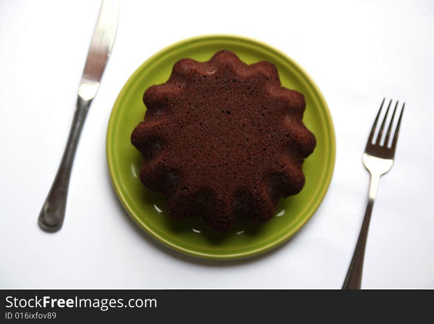 Chocolate cake on a green dish. Chocolate cake on a green dish