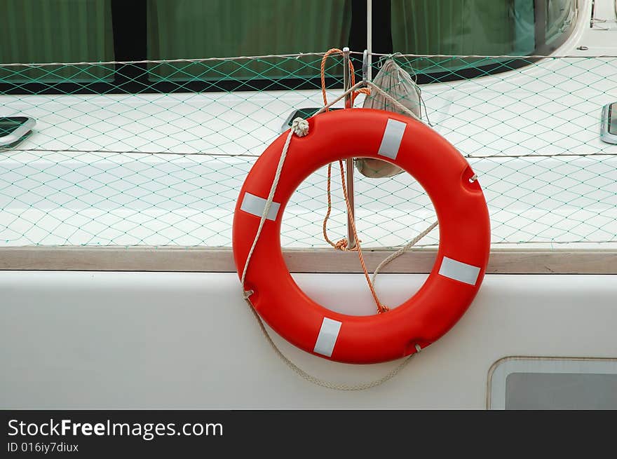 Llife-preserver ring on white yacht