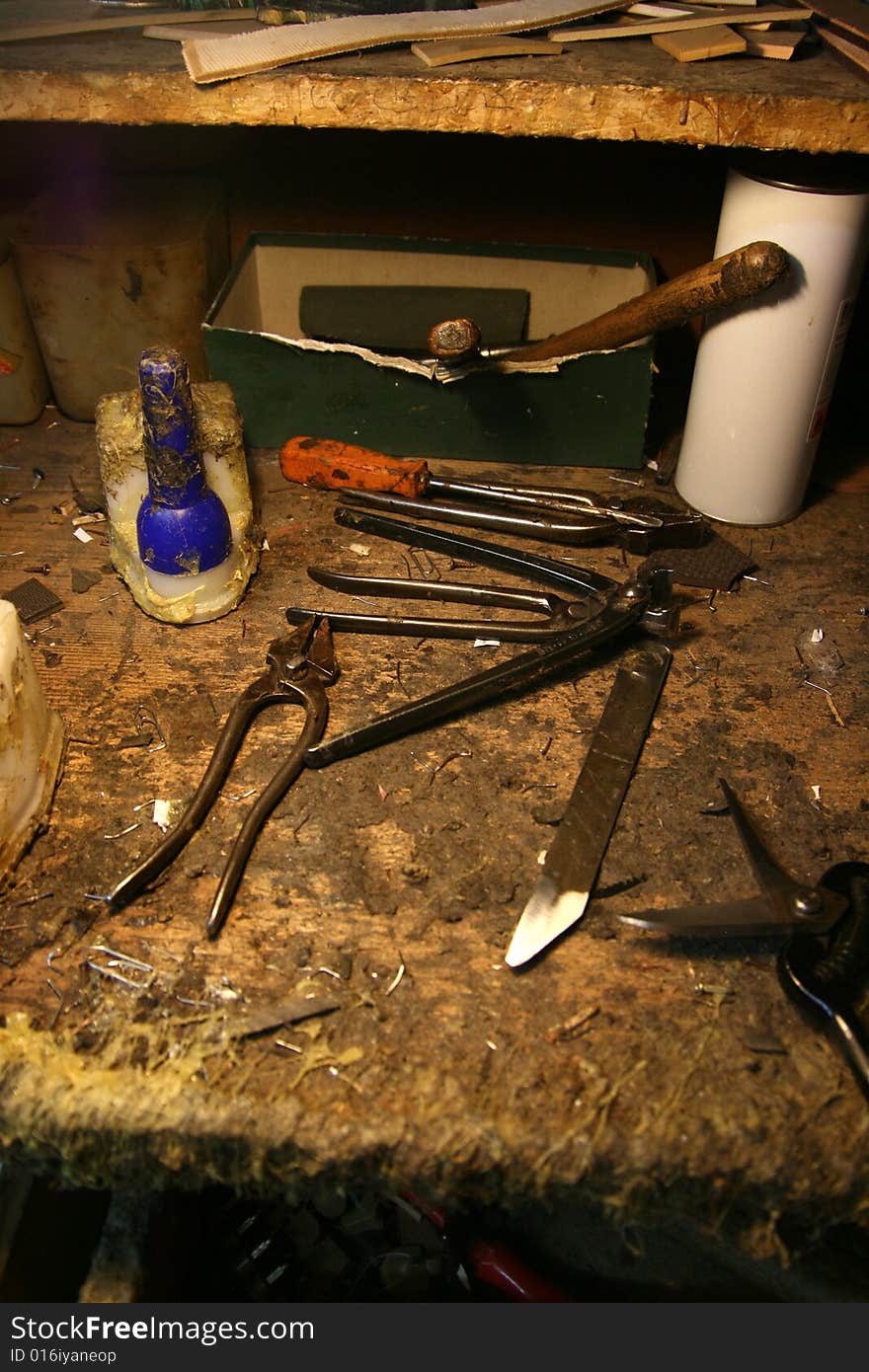 Tools of shoemaker in a old style shop. Tools of shoemaker in a old style shop