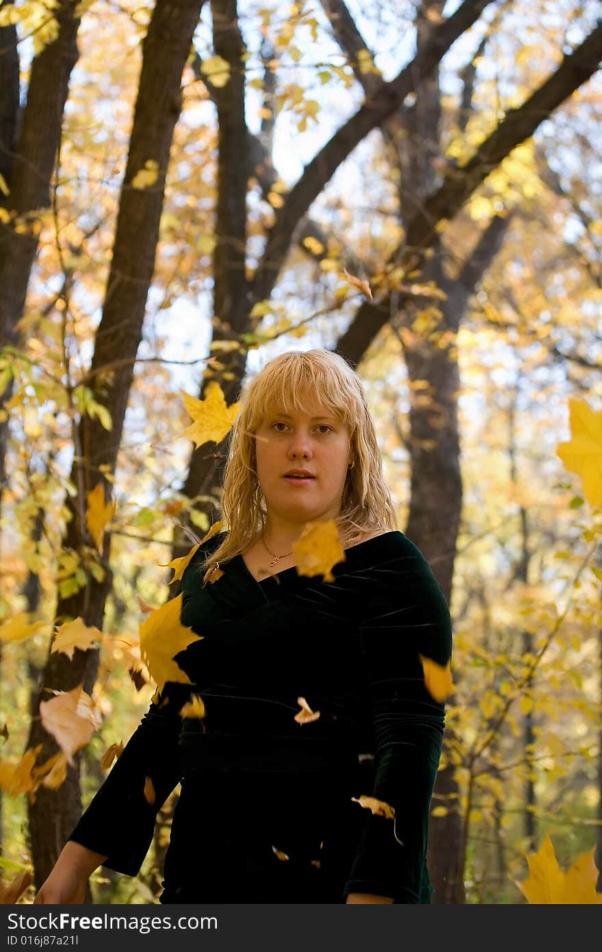 Beautiful girl in black walking in autumn park. Beautiful girl in black walking in autumn park