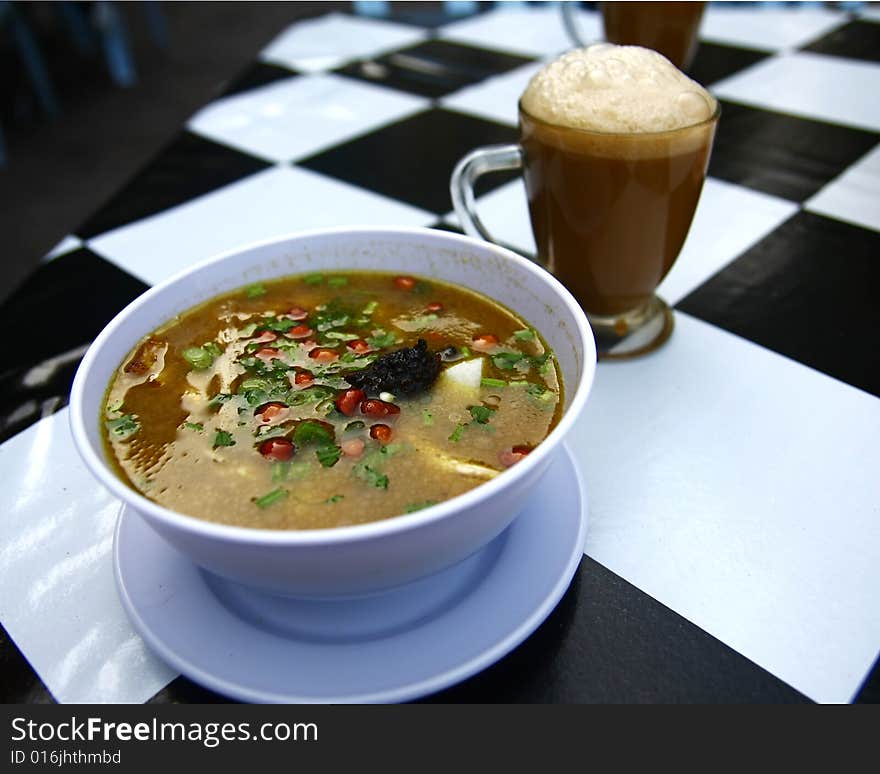 A noodle soup named 'Soto' in Malaysia with Milk Tea also known as 'Teh Tarik' among the locals. A noodle soup named 'Soto' in Malaysia with Milk Tea also known as 'Teh Tarik' among the locals.