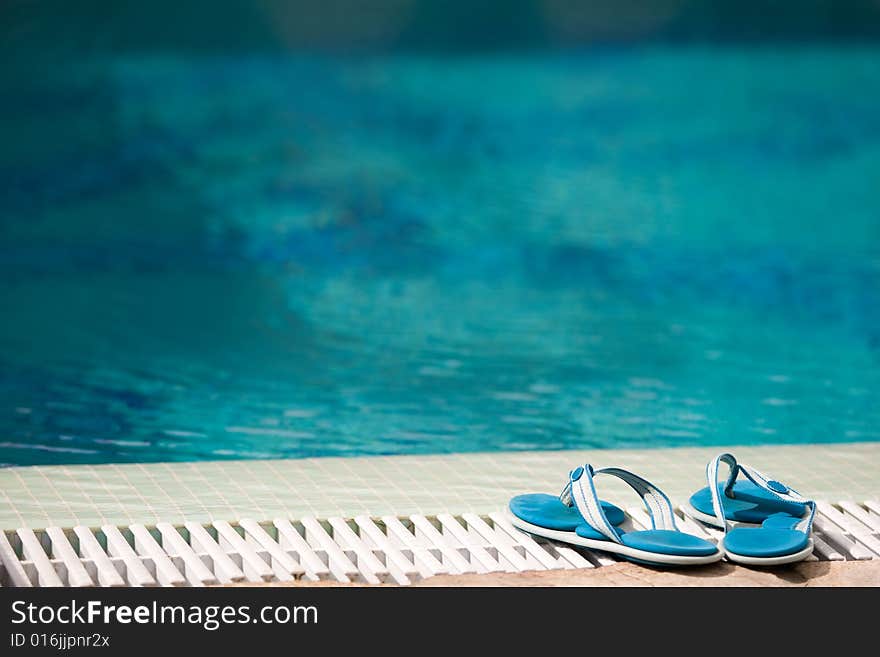 Slippers near swimming pool