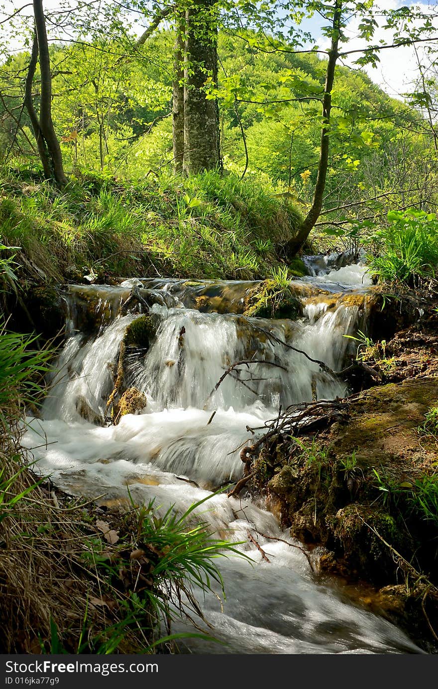 Small waterfall on a stream in mountain resort