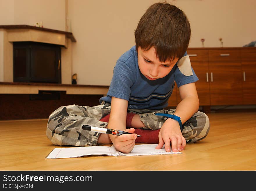 Little Boy Learning To Write