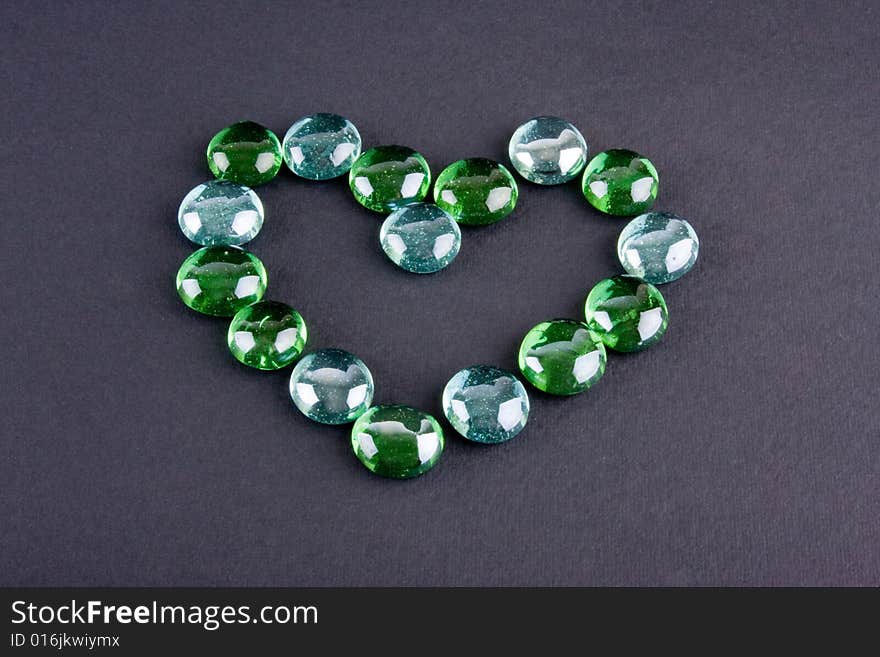 Glass stones making heart shape