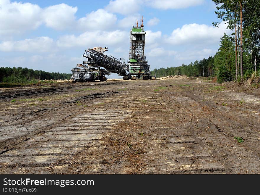 Big coal digger on it's way to new working place in coal mine.