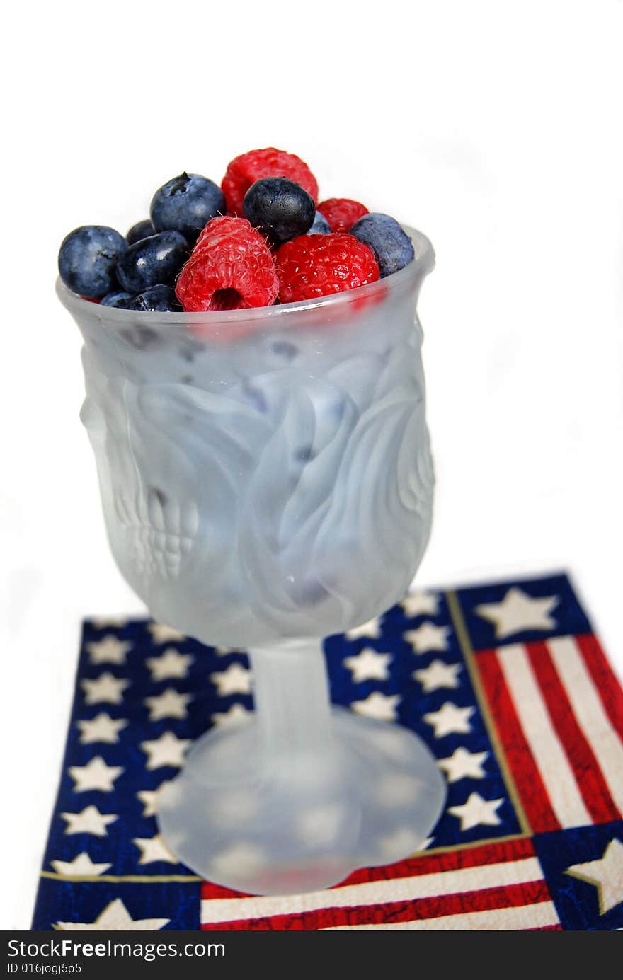 Fresh berries in a goblet on a patriotic napkin. Fresh berries in a goblet on a patriotic napkin.